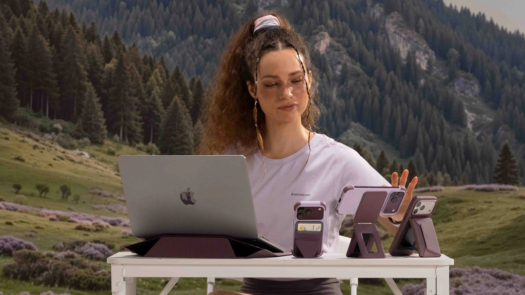 A compact mobile work setup on a cafe table with the Tripod Stand and Field Wallet
