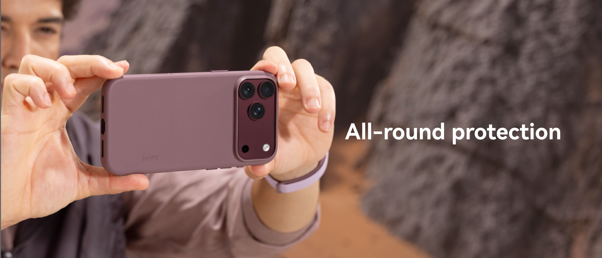 Person taking a photo with an iPhone 18 in the MOFT Snap Case MOVAS
